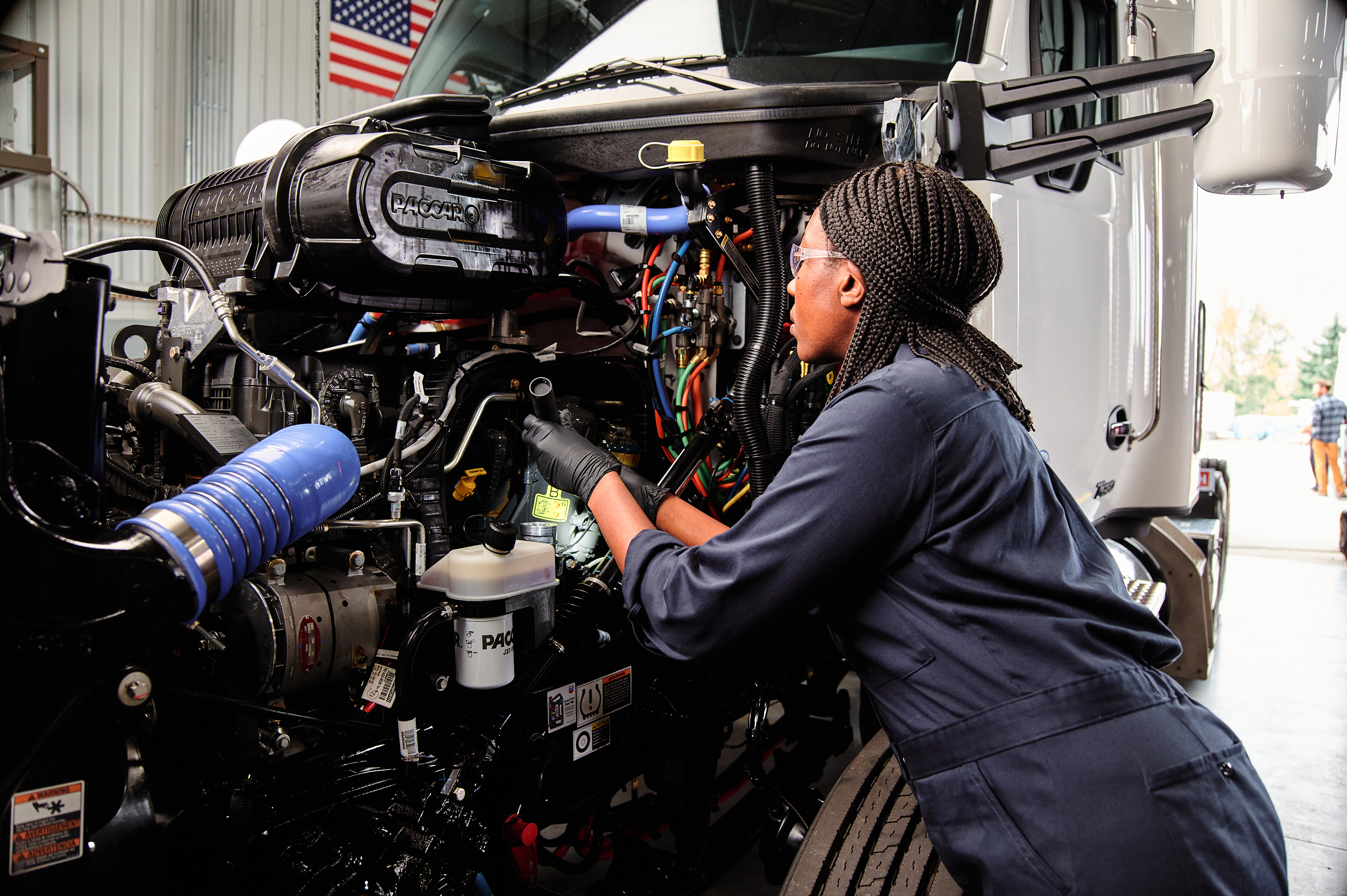 A technician services a Kenworth truck